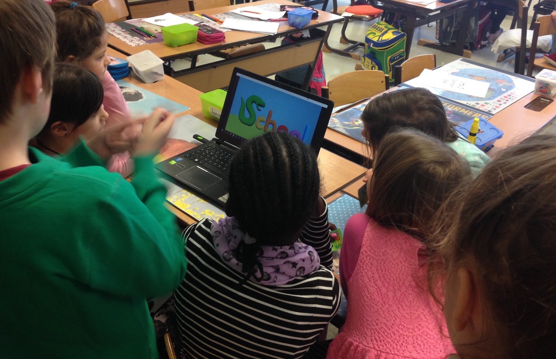 Children looking at the presentation of scool